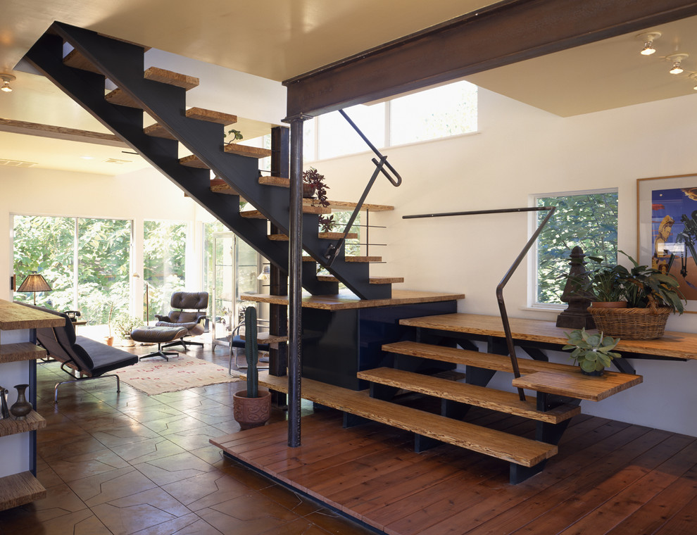 Photo of a contemporary wood staircase in Austin with open risers.