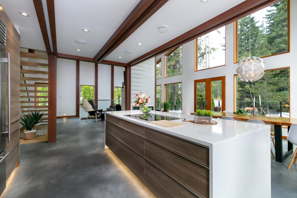 Photo of a midcentury open plan kitchen in Other with flat-panel cabinets, brown cabinets, concrete floors, with island, grey floor, white benchtop and exposed beam.