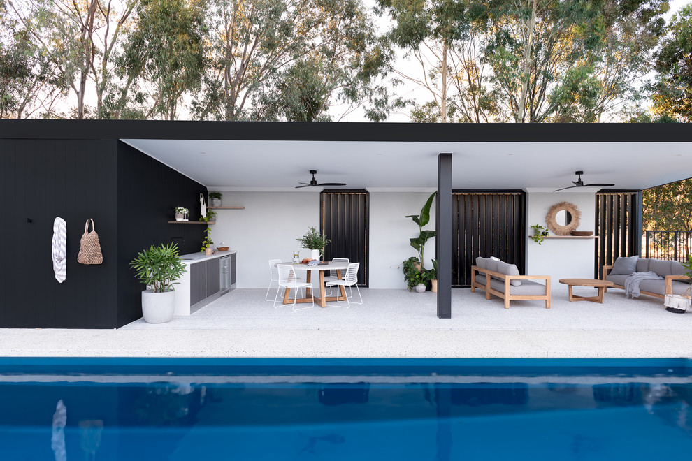 Mid-sized contemporary backyard patio in Perth with a pergola.