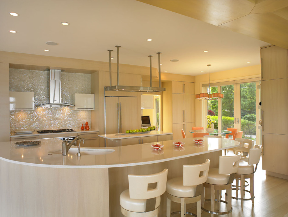 Photo of a modern kitchen in Miami with white splashback, flat-panel cabinets and light wood cabinets.