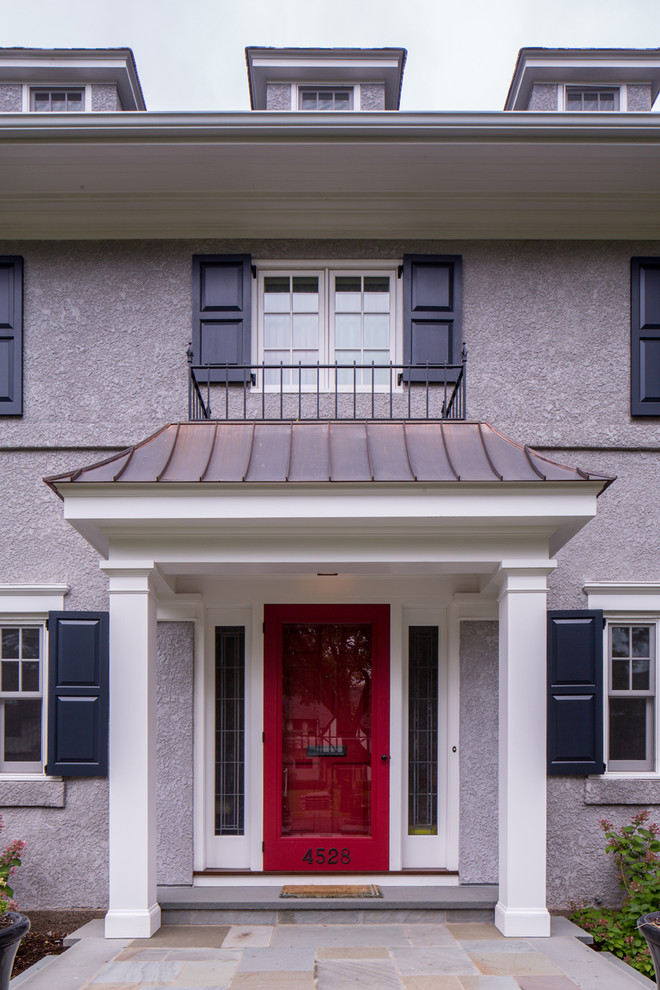 Traditional entryway in Minneapolis with a glass front door.