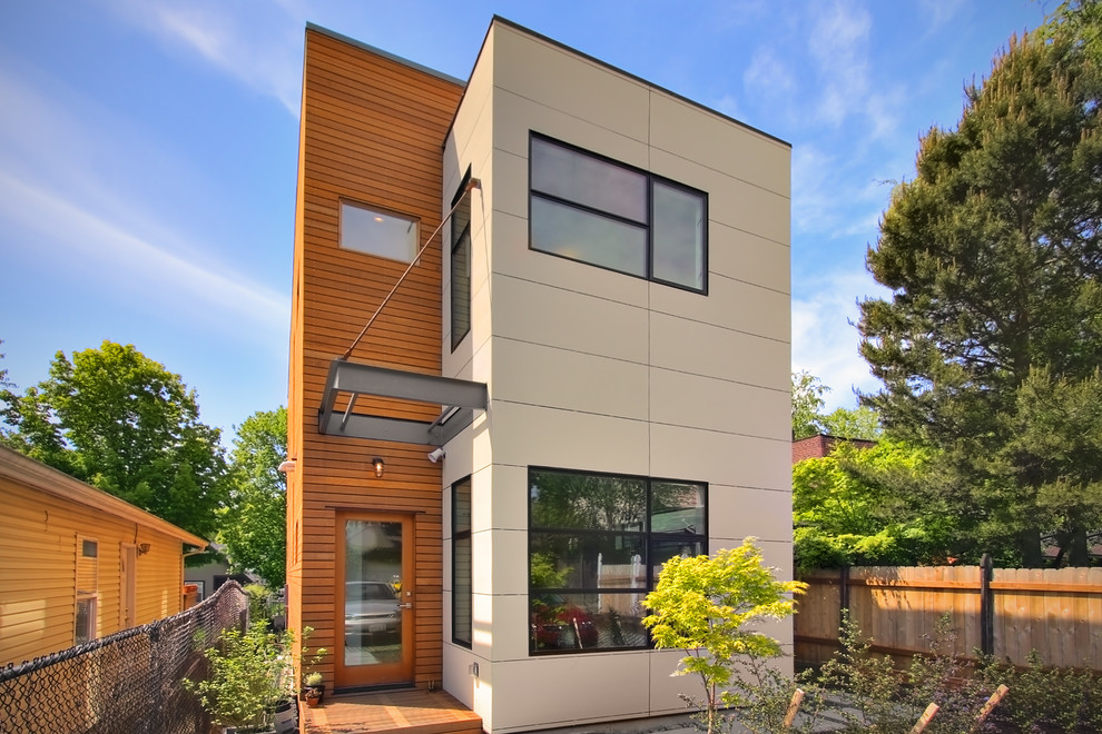 Inspiration for a modern apartment exterior in Seattle with wood siding.