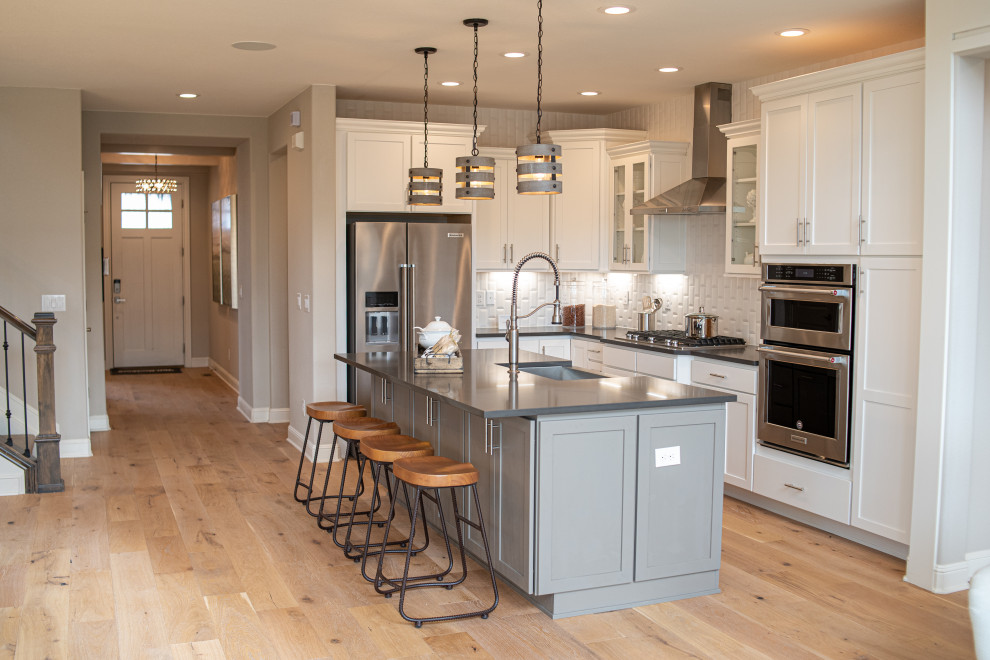 Example of a transitional kitchen design in Denver