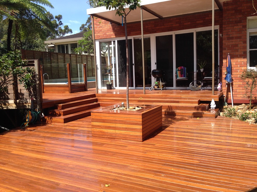 Large contemporary backyard deck in Sydney with no cover.