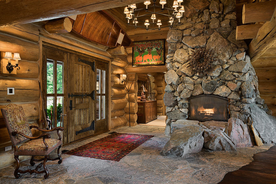 Foyer - huge rustic foyer idea in Chicago with brown walls and a medium wood front door