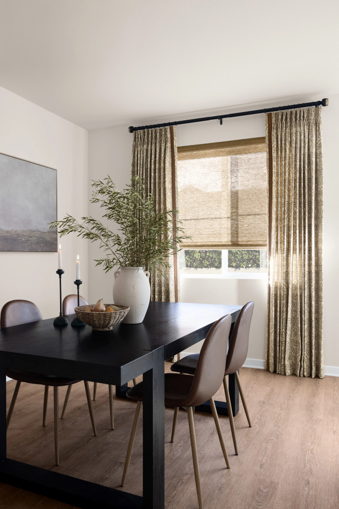 Inspiration for a mid-sized transitional medium tone wood floor and brown floor kitchen/dining room combo remodel in Atlanta with white walls