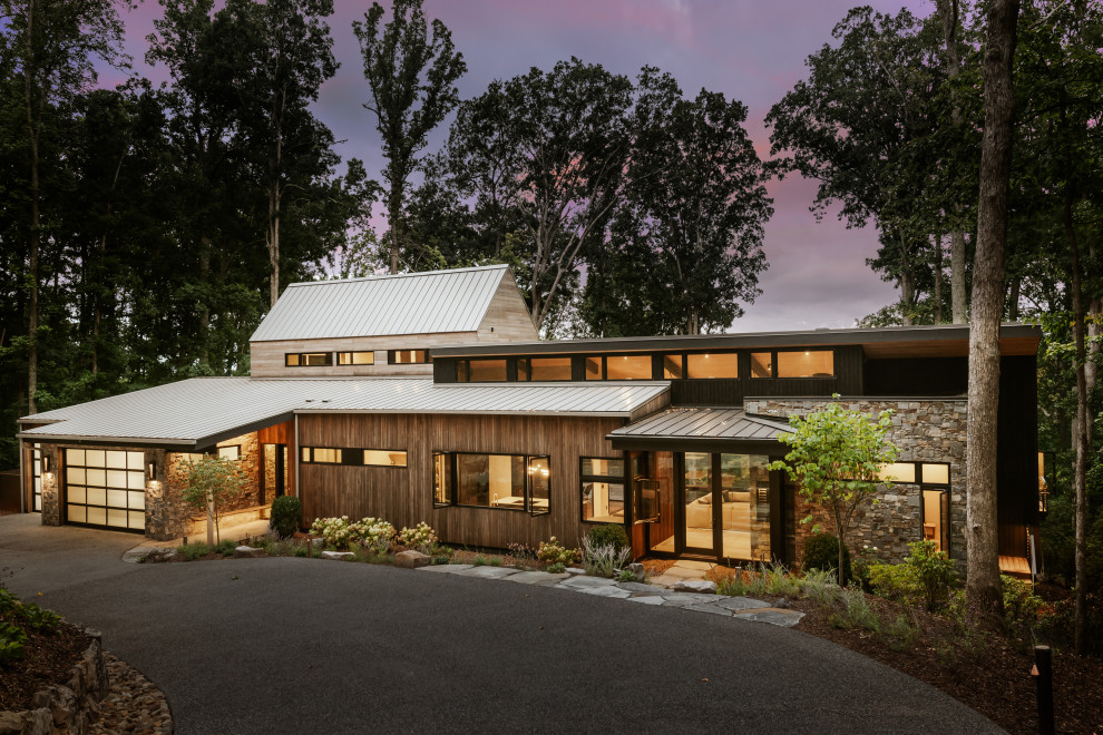 Inspiration för ett minimalistiskt hus, med tak i metall