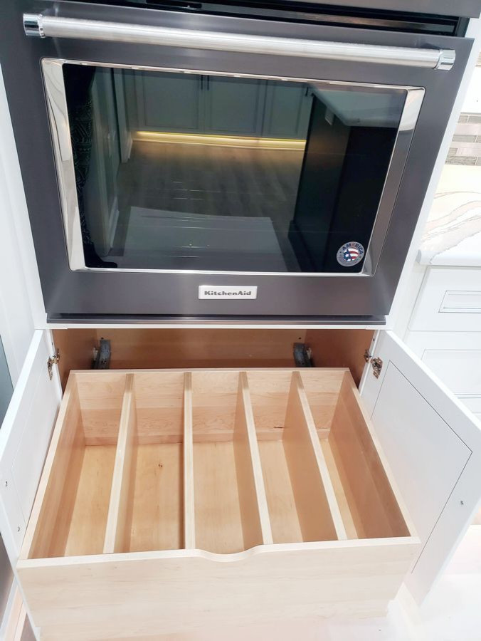 Inspiration for a transitional u-shaped eat-in kitchen remodel with recessed-panel cabinets, white cabinets, quartz countertops, multicolored backsplash, mosaic tile backsplash, two islands and white countertops