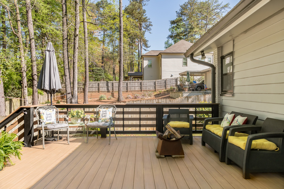 Inspiration for a medium sized modern back ground level wood railing terrace in Atlanta with no cover.