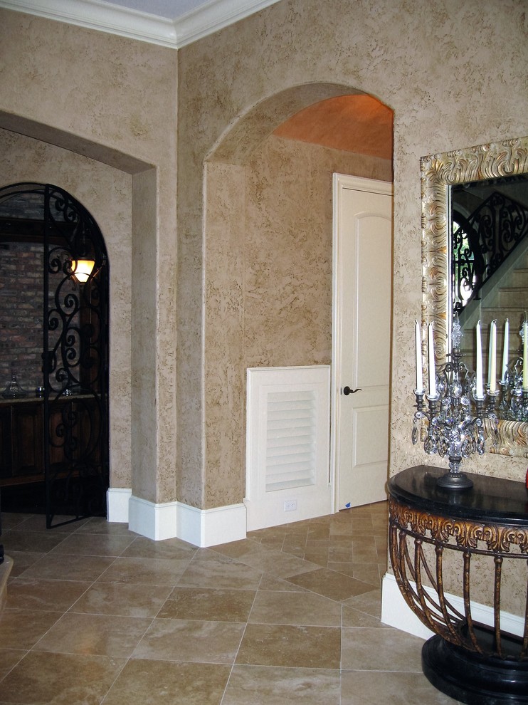 Design ideas for an expansive traditional foyer in Houston with multi-coloured walls, travertine floors, a double front door and a metal front door.