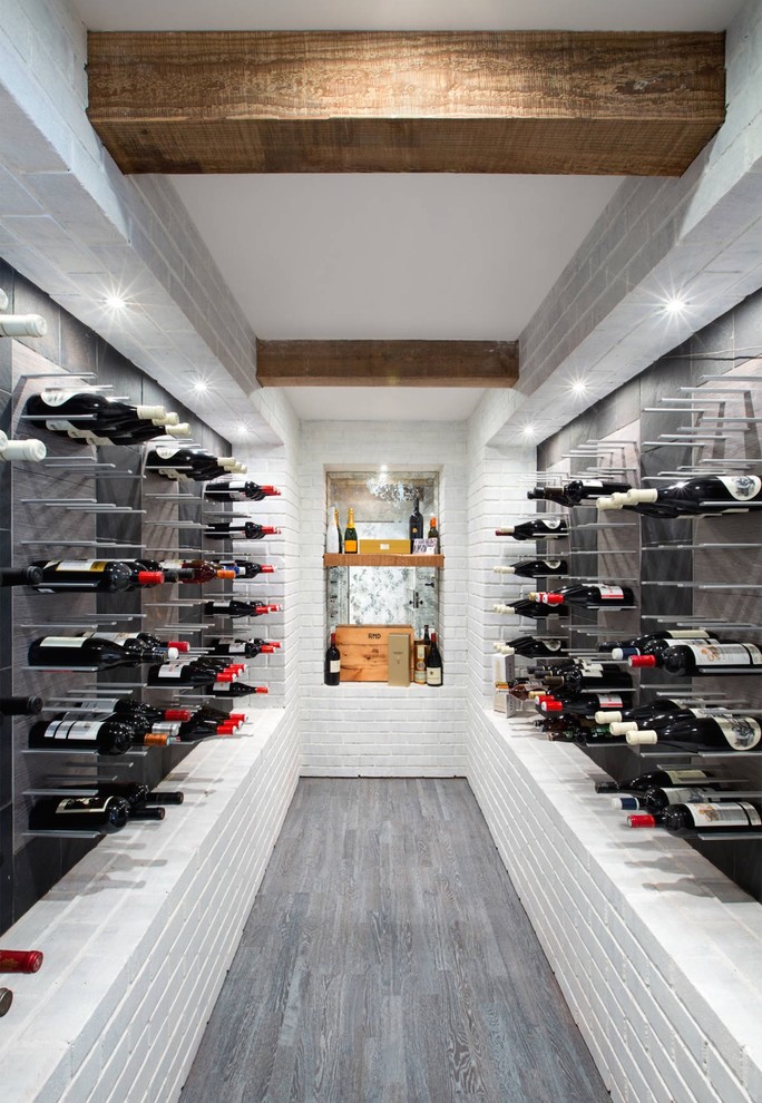 Inspiration for an expansive modern wine cellar in New York with display racks.
