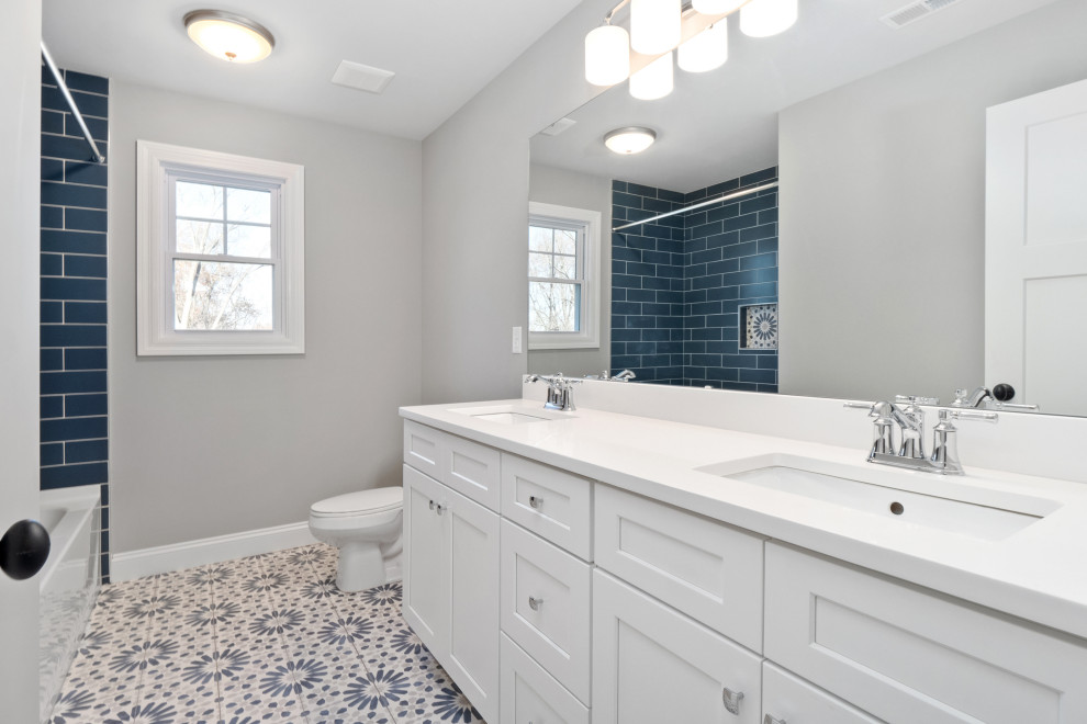Inspiration for a transitional kids' blue tile and ceramic tile porcelain tile, multicolored floor and double-sink bathroom remodel in St Louis with shaker cabinets, white cabinets, gray walls, an undermount sink, quartz countertops, white countertops and a built-in vanity