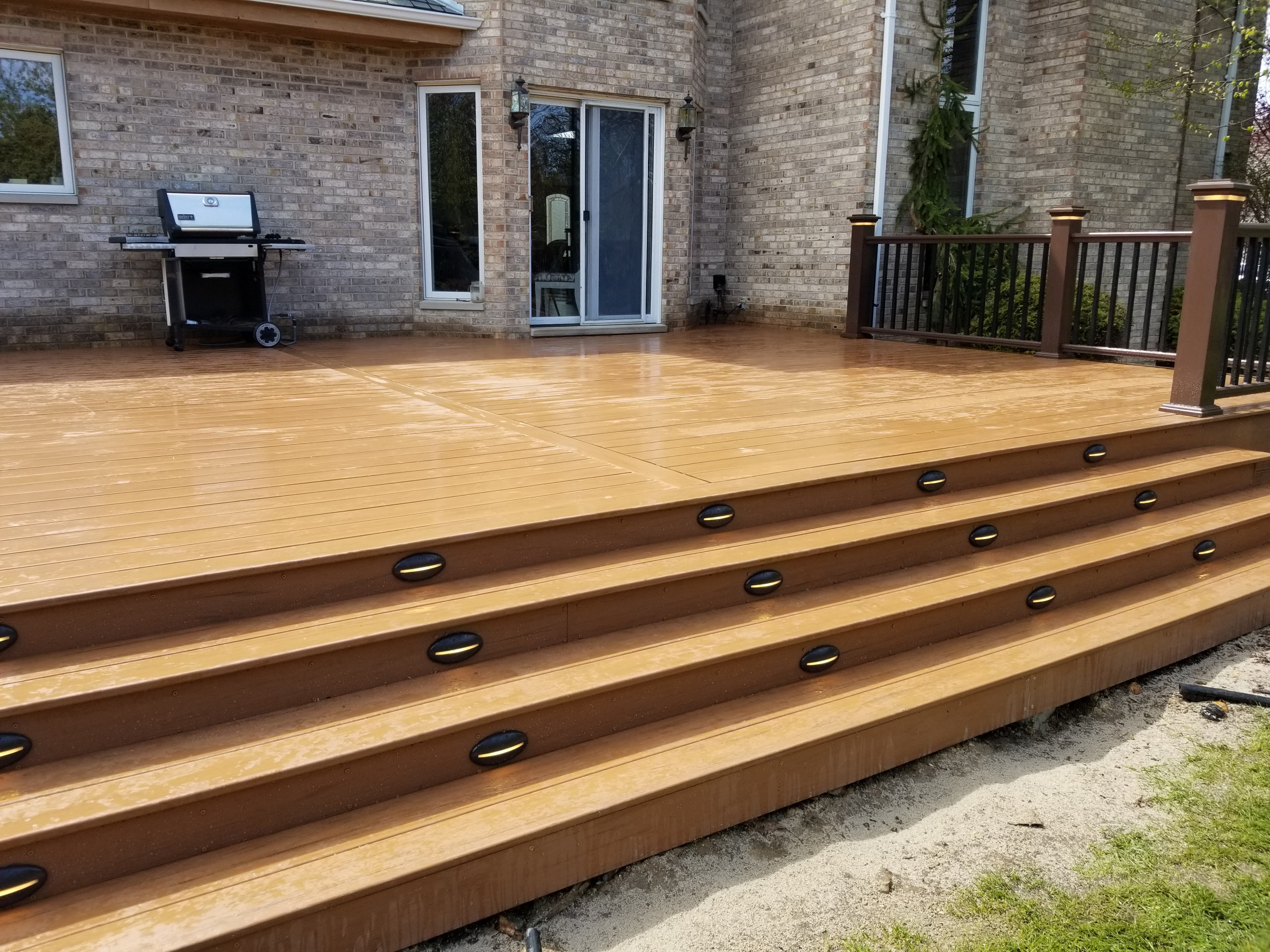 Composite deck with composite railing and lighting