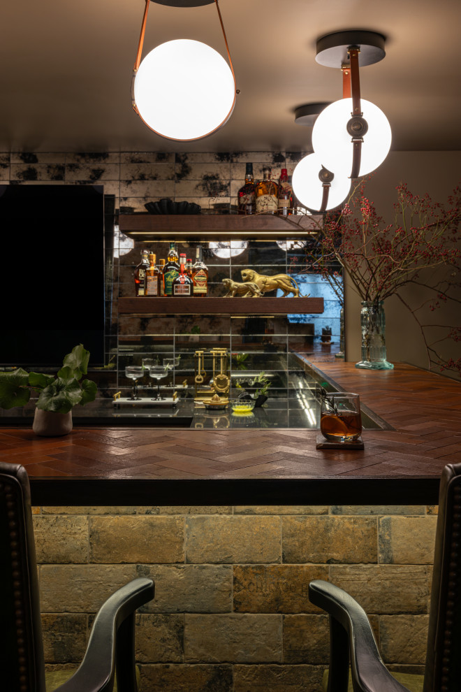 Inspiration for a transitional basement remodel in Chicago with a bar and green walls