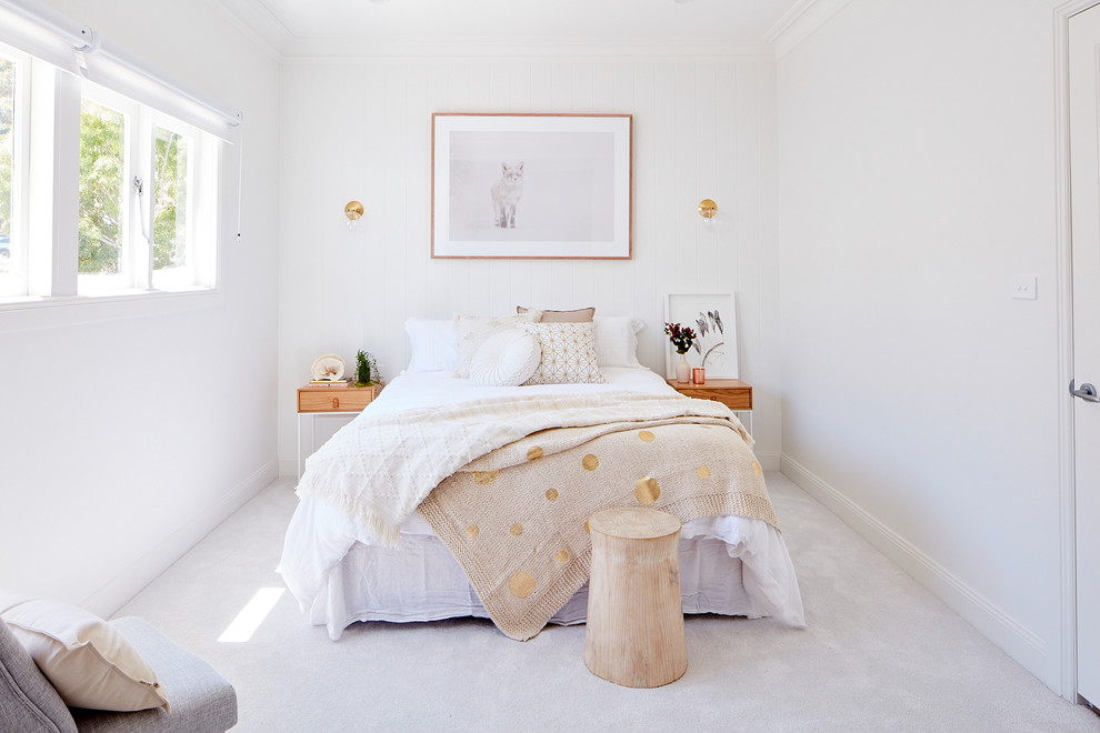 This is an example of a mid-sized modern master bedroom in Sydney with white walls, carpet, no fireplace and white floor.