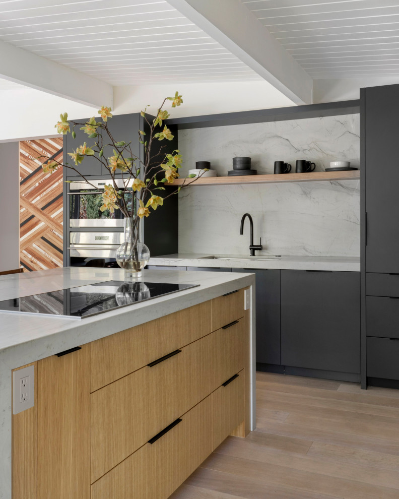 Design ideas for an expansive contemporary l-shaped eat-in kitchen in San Francisco with an undermount sink, flat-panel cabinets, grey cabinets, marble benchtops, white splashback, marble splashback, panelled appliances, light hardwood floors, with island, white benchtop and exposed beam.