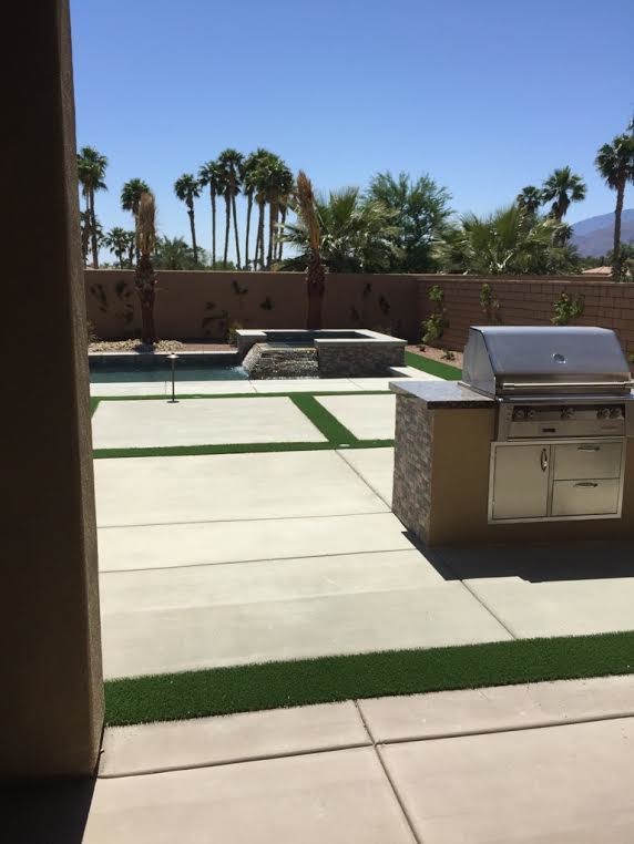 Mid-sized backyard concrete paver hot tub photo