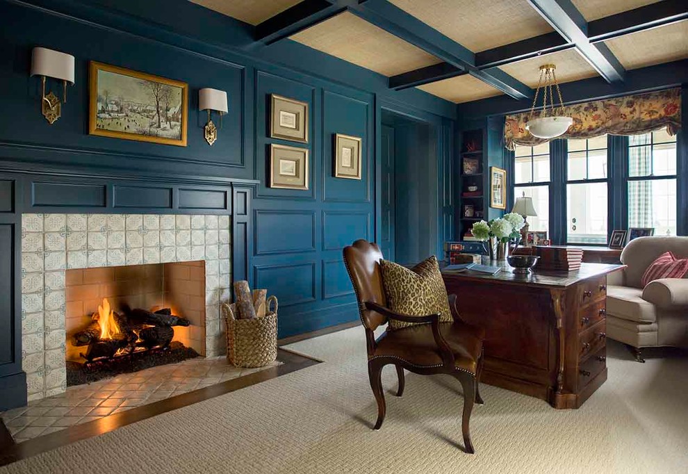 Traditional study room in Los Angeles with blue walls, a standard fireplace, a tile fireplace surround, a freestanding desk and carpet.