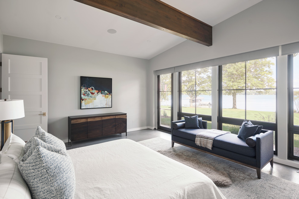 Inspiration for an expansive modern master bedroom in Grand Rapids with concrete floors and grey floor.