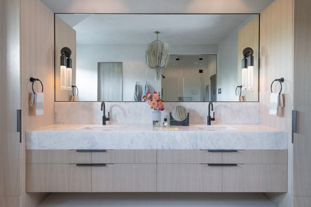 Photo of a large country master bathroom in Other with flat-panel cabinets, light wood cabinets, quartzite benchtops, a double vanity and a floating vanity.