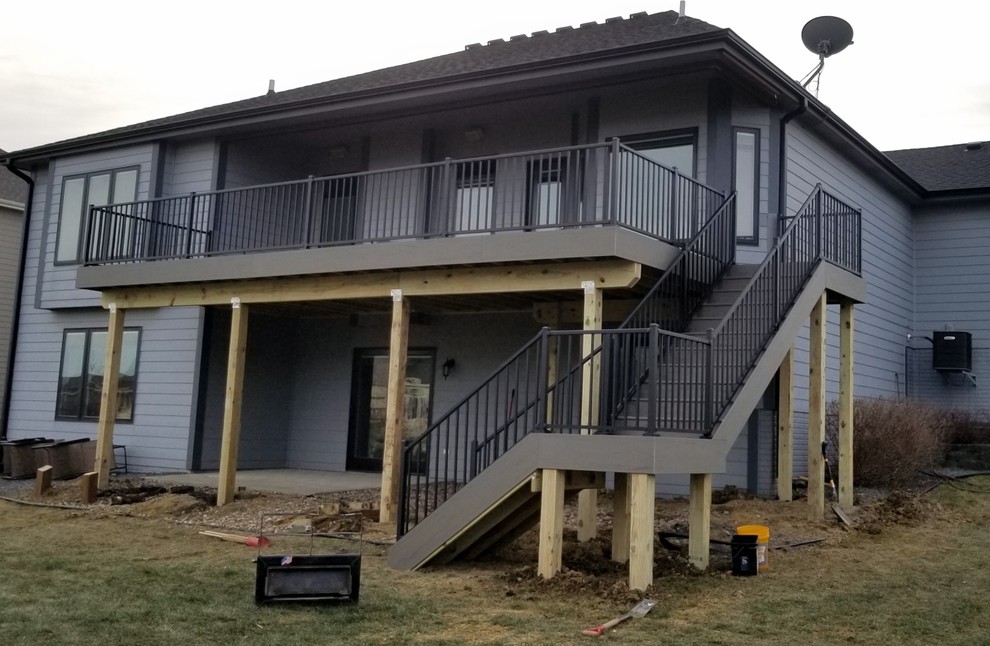 Inspiration for a large backyard deck remodel with no cover