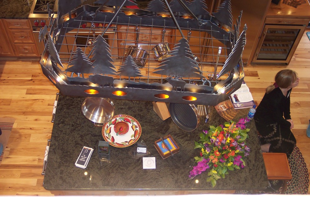 Example of a mountain style kitchen design with granite countertops