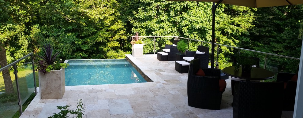Design ideas for a mid-sized contemporary custom-shaped aboveground pool in Other.