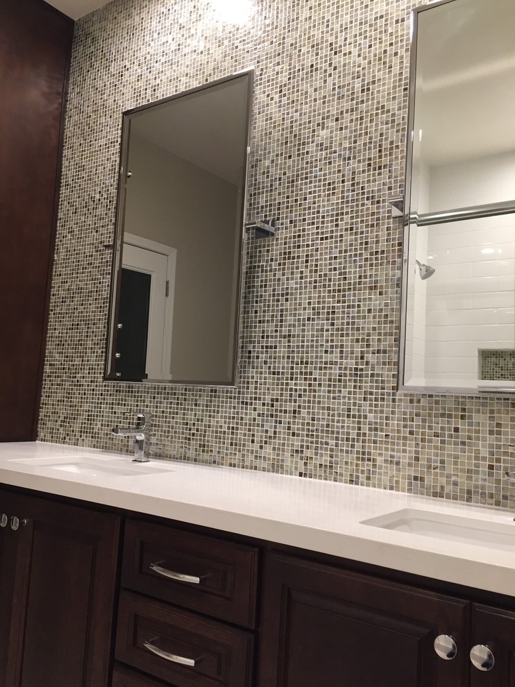 Mid-sized contemporary kids bathroom in Phoenix with an undermount sink, raised-panel cabinets, dark wood cabinets, engineered quartz benchtops, an alcove tub, an alcove shower, a two-piece toilet, white tile, ceramic tile, beige walls and travertine floors.
