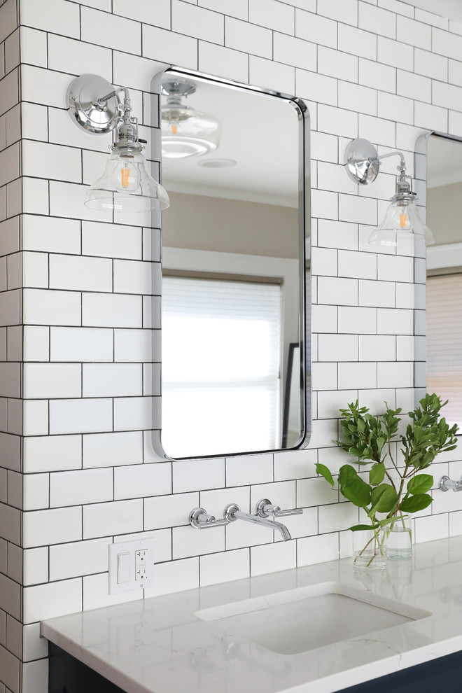 Inspiration for a mid-sized transitional master bathroom in Chicago with recessed-panel cabinets, blue cabinets, white tile, ceramic tile, an undermount sink, engineered quartz benchtops and white benchtops.