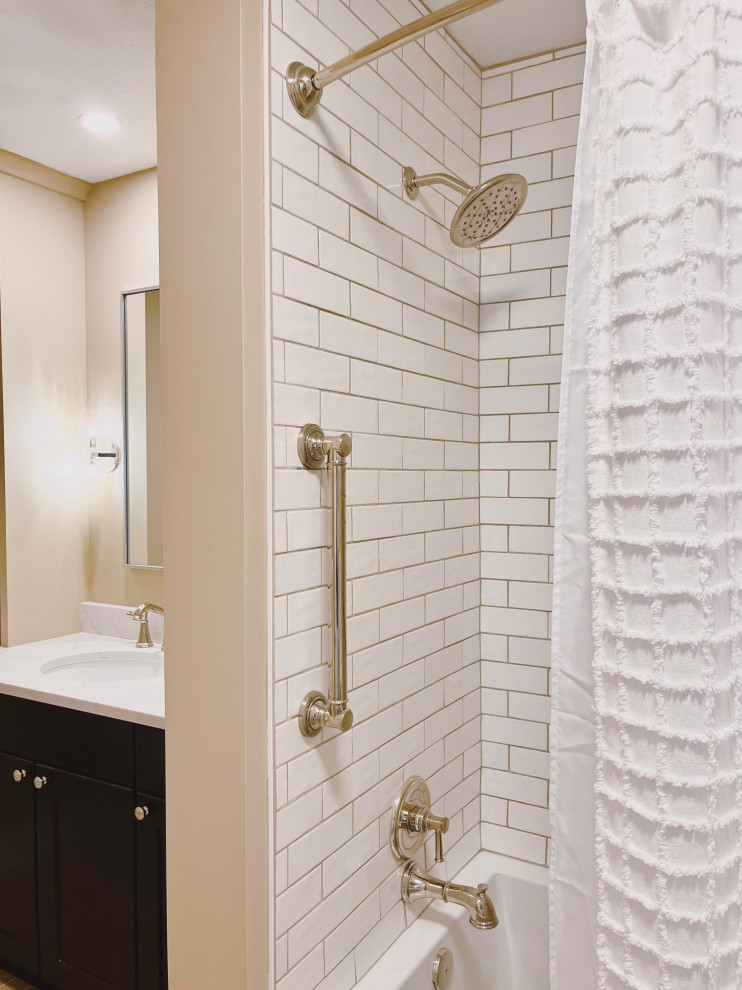 Alcove bathtub - mid-sized transitional white tile and ceramic tile porcelain tile, beige floor and single-sink alcove bathtub idea with shaker cabinets, dark wood cabinets, a two-piece toilet, beige walls, an undermount sink, quartz countertops, beige countertops and a built-in vanity