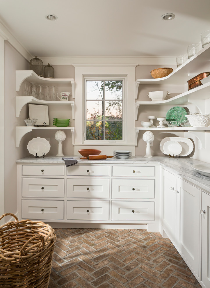 Small mountain style l-shaped brick floor kitchen pantry photo in Other with white cabinets, gray countertops, shaker cabinets, marble countertops, white backsplash and white appliances