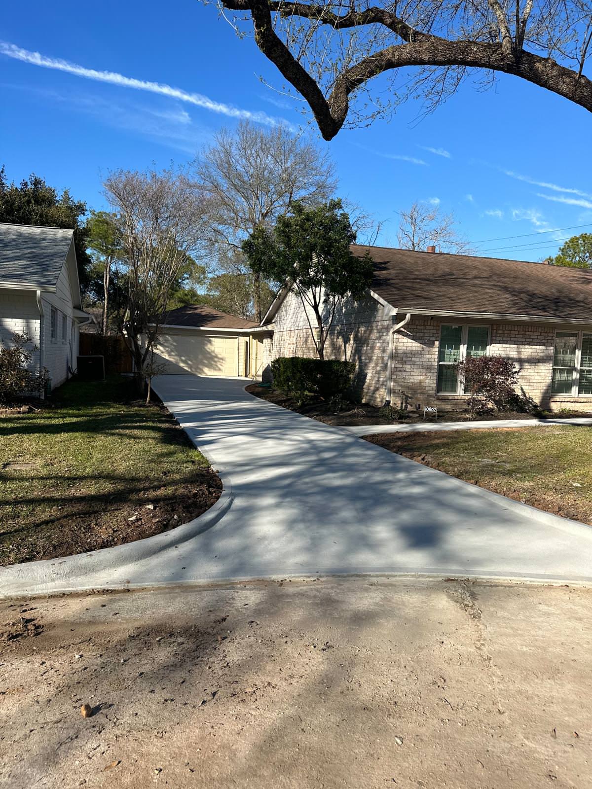 New driveway with sidewalks and stamped concrete!