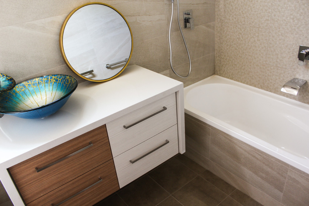 Design ideas for a small modern master bathroom in Perth with light wood cabinets, a drop-in tub, a shower/bathtub combo, a one-piece toilet, beige tile, porcelain tile, beige walls, porcelain floors, a vessel sink and quartzite benchtops.