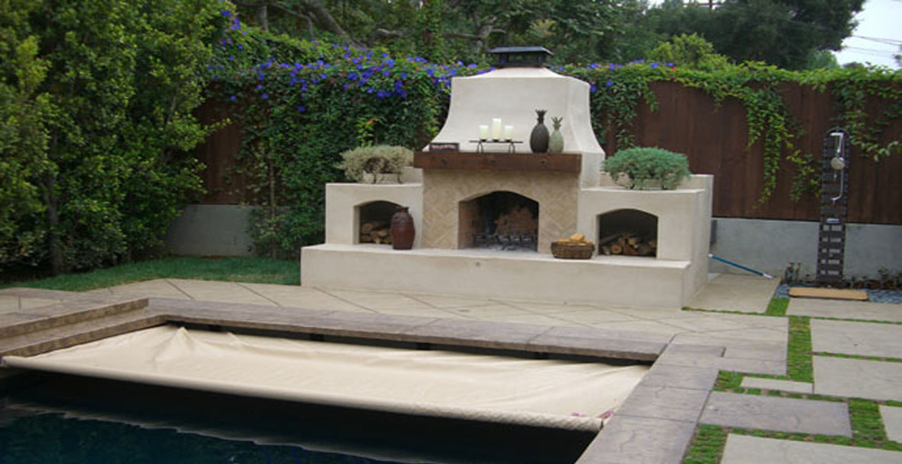 Tuscan backyard pool photo in Los Angeles