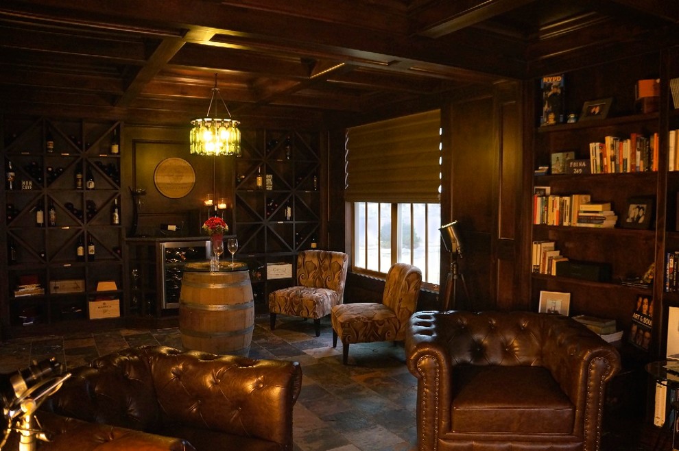 Inspiration for a mid-sized transitional living room in Chicago with a library, beige walls and slate floors.