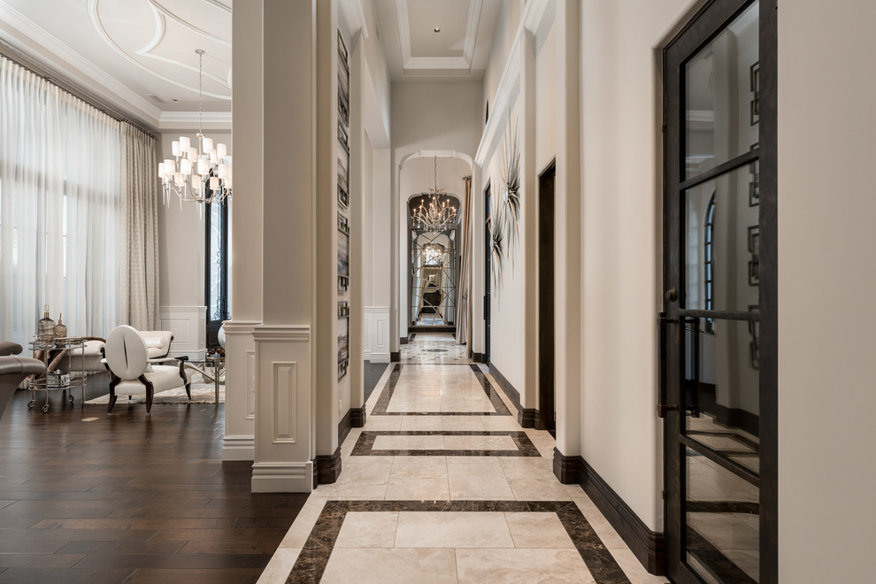 Expansive mediterranean hallway in Phoenix with multi-coloured walls, marble floors, multi-coloured floor, coffered and panelled walls.