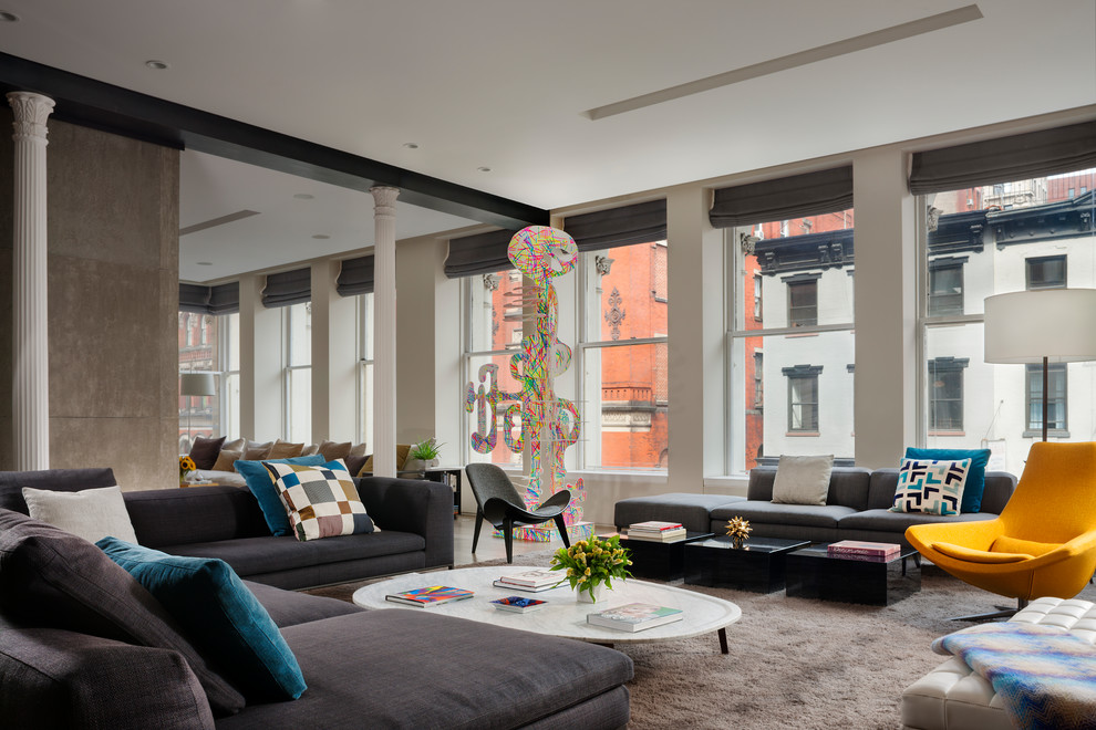 Trendy formal and open concept carpeted and gray floor living room photo in New York with white walls