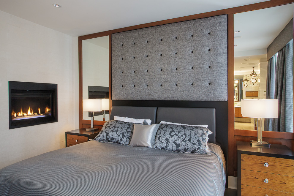 This is an example of a contemporary bedroom in Vancouver with white walls.
