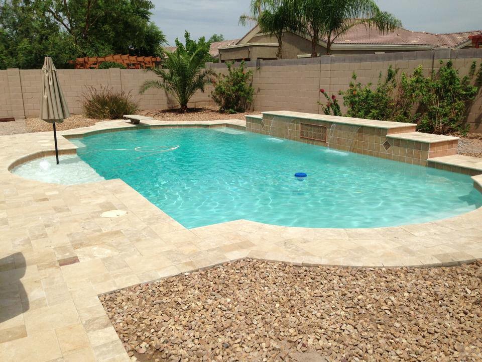 Inspiration for a large backyard tile and custom-shaped lap pool fountain remodel in Phoenix