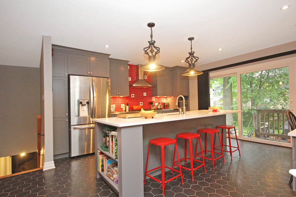 Mid-sized eclectic galley eat-in kitchen in Ottawa with an undermount sink, recessed-panel cabinets, grey cabinets, quartz benchtops, red splashback, ceramic splashback, stainless steel appliances, ceramic floors and with island.