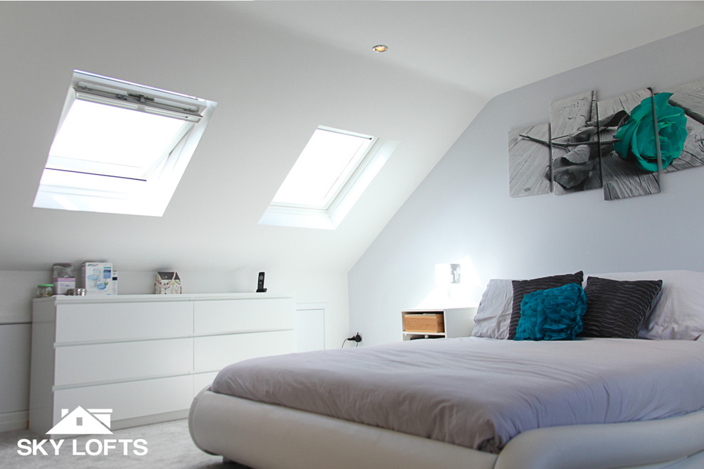 This is an example of a modern loft-style bedroom in Hampshire.