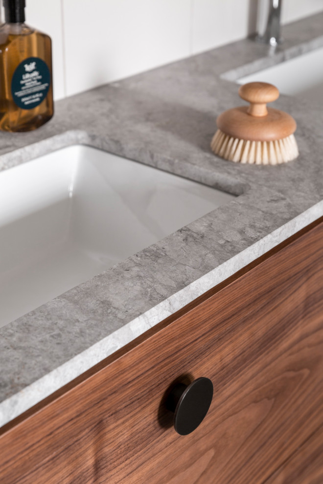 This is an example of a contemporary bathroom in Other with flat-panel cabinets, medium wood cabinets, a freestanding tub, white tile, white walls, an undermount sink, blue floor, grey benchtops, a single vanity and a floating vanity.