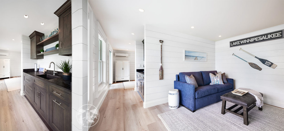 This is an example of a medium sized coastal open plan living room in Boston with white walls, vinyl flooring, no fireplace, a wall mounted tv, beige floors and tongue and groove walls.