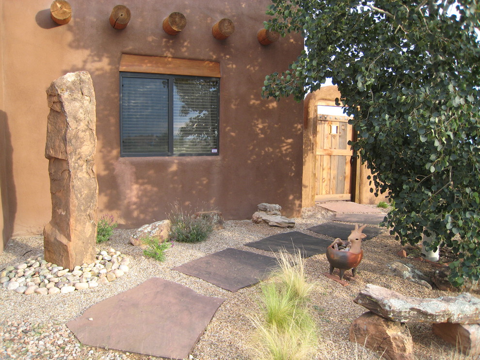 Design ideas for a desert look xeriscape in Philadelphia with natural stone pavers.
