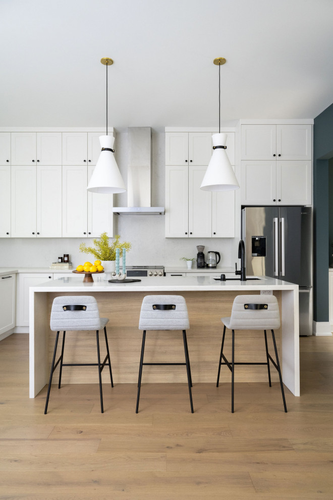 Example of a transitional kitchen design in Toronto