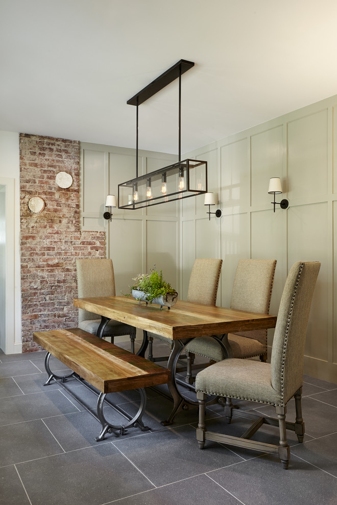 This is an example of a mid-sized country separate dining room in Philadelphia with green walls, slate floors and grey floor.