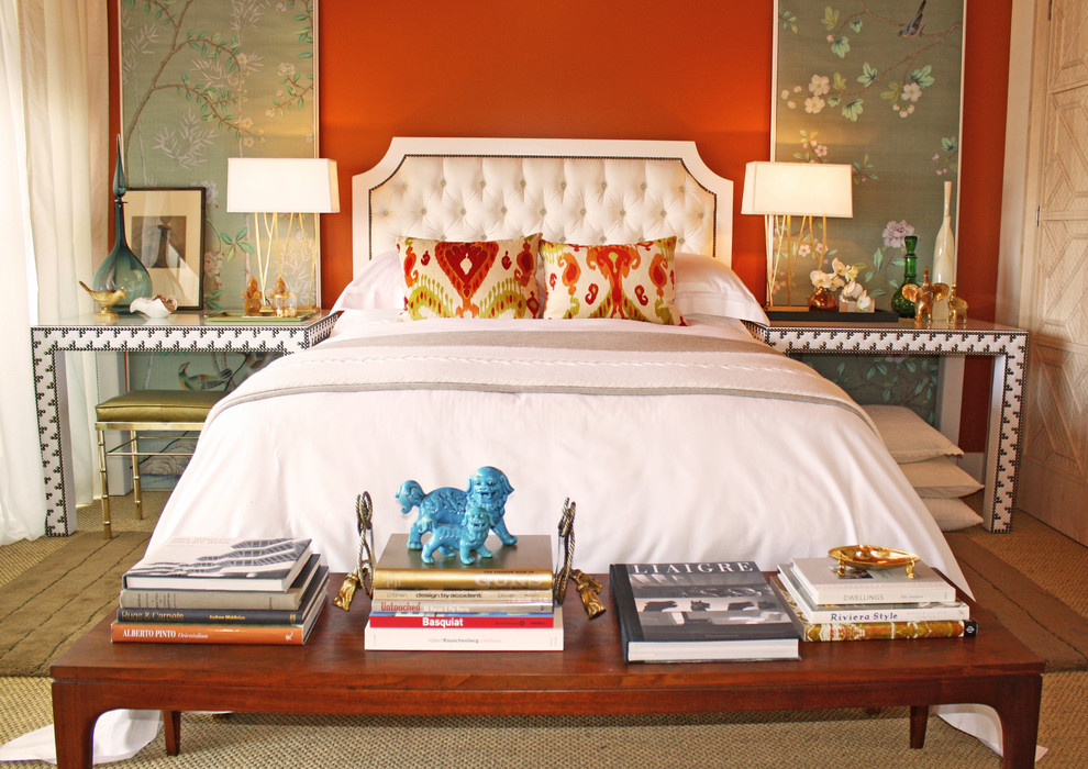 Design ideas for an eclectic guest bedroom in Orange County with red walls and carpet.