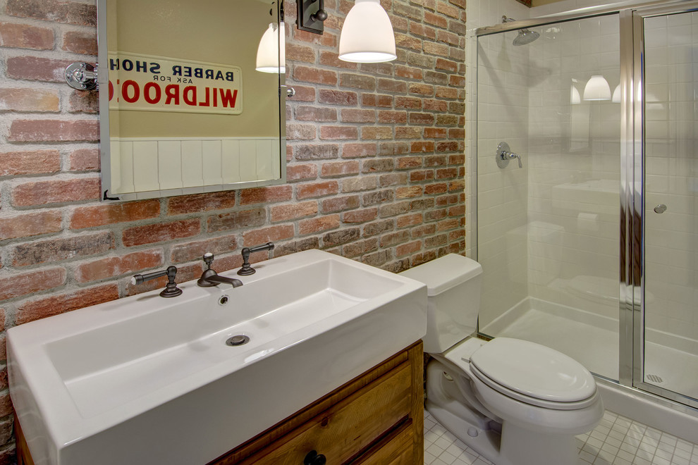 This is an example of a small transitional bathroom in Denver with furniture-like cabinets, distressed cabinets, an alcove shower, a two-piece toilet, red tile, subway tile, red walls, linoleum floors, an integrated sink, solid surface benchtops, white floor, a hinged shower door and white benchtops.