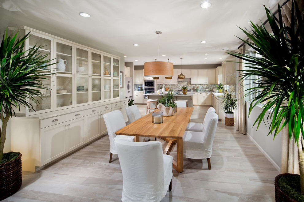 Photo of a mediterranean kitchen/dining combo in Orange County with grey walls.
