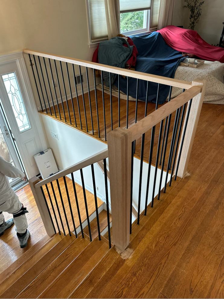 Black stairs with orangey oak floors?